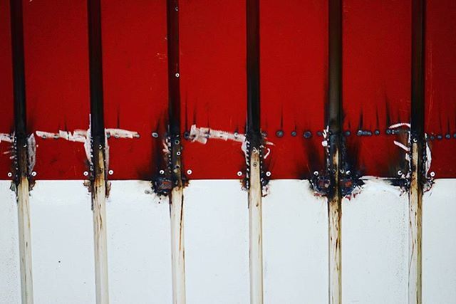 red, in a row, side by side, indoors, repetition, order, close-up, full frame, hanging, backgrounds, metal, still life, large group of objects, arrangement, no people, chair, striped, group of objects, abundance, day