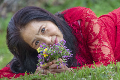 Portrait of woman with pink flowers