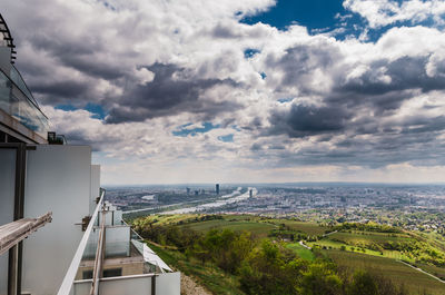 High angle view of river amidst buildings against sky