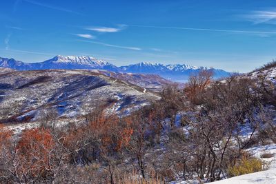 Scenic view of snowcapped mountains against sky