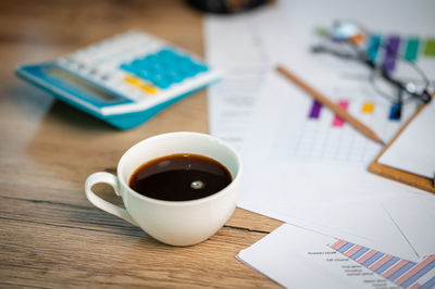 High angle view of coffee cup on table