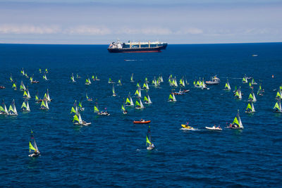 Boats in sea against sky