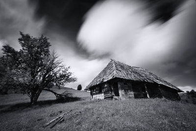 House on field against sky