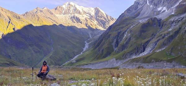 Rear view of man on mountain range