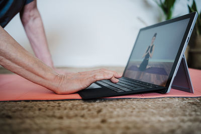 Woman using digital tablet at home