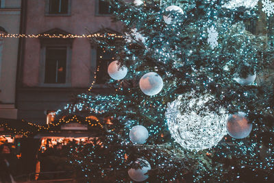 Close-up of illuminated christmas tree at night