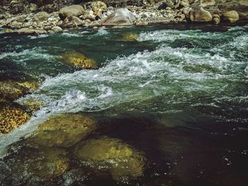 Close-up of rocks in river