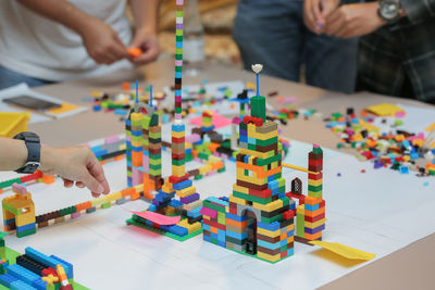 People playing with toy toys on table