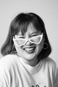 Portrait of smiling girl against white background