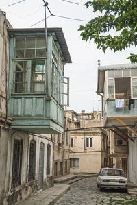 Street amidst buildings against sky