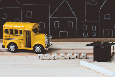 Yellow toy car on table