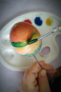 Close-up of hand holding ice cream