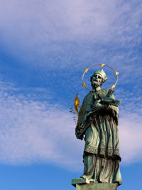 Low angle view of statue against sky