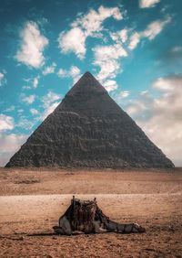 View of pyramid against cloudy sky