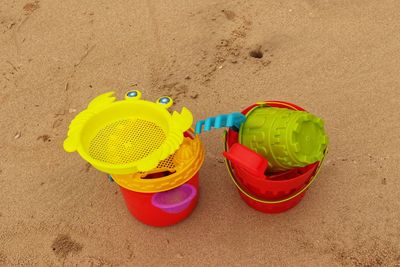 High angle view of toys on beach