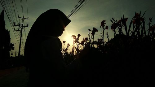 Silhouette of person against sky