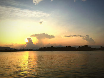 Scenic view of lake against sky during sunset