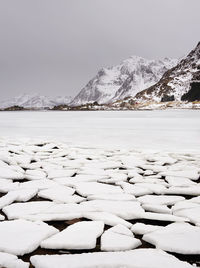 Scenic view of frozen lake against sky