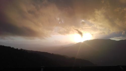 Silhouette mountains against sky during sunset