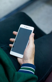 Close-up of man using mobile phone