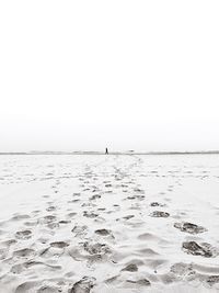 Scenic view of calm sea against clear sky