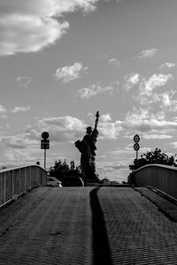 Road against cloudy sky