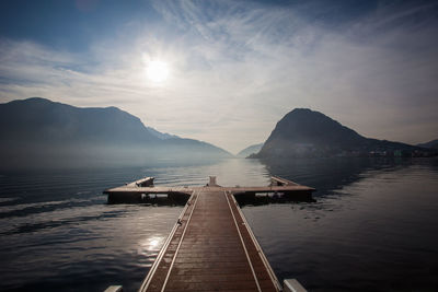 Autumnal down from mooring in the lugano lakefront, switzerland