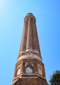 Low angle view of historical building against clear blue sky