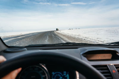 Road seen through car windshield