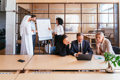 Business colleagues working in office