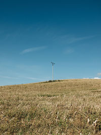 Scenic view of field against blue sky