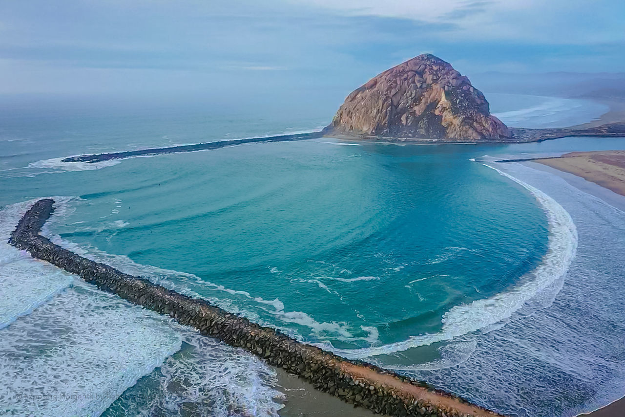 PANORAMIC VIEW OF SEA AND ROCKS AGAINST SKY