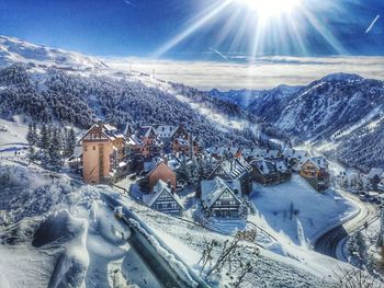 Aerial view of snowcapped mountains against sky