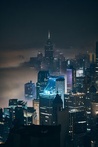 Illuminated buildings in city at night