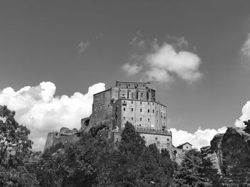 Low angle view of historical building against sky sacra di san michele