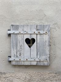 Close-up of closed door on wall