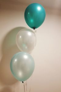 Low angle view of balloons on wall during event