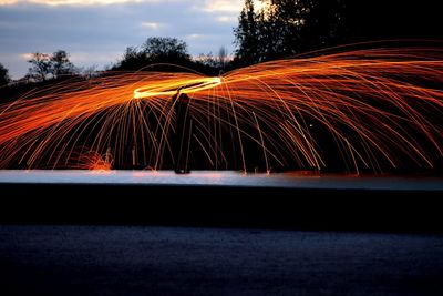 Illuminated fountain at night