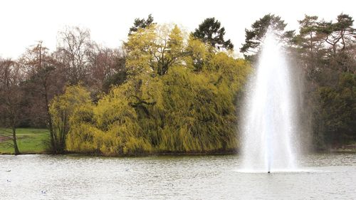 Scenic view of waterfall against clear sky