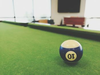 Close-up of pool ball on table