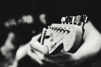 Close-up of playing guitar