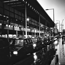 Cars in illuminated city