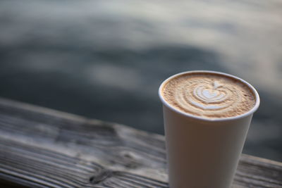 Close-up of cappuccino on table