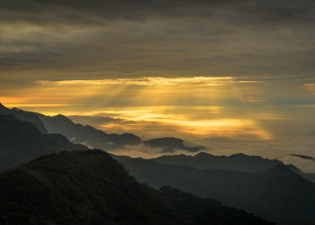 Scenic view of mountains against sky during sunset