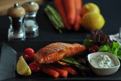 Close-up of fruits in plate on table