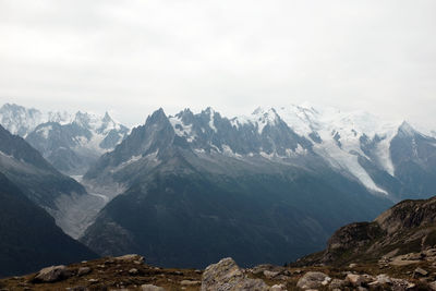 Scenic view of snowcapped mountains against sky