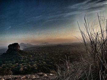 Scenic view of landscape against sky during sunset