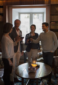 Business people toasting wineglasses at restaurant lobby