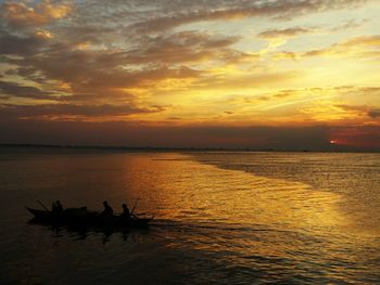 Scenic view of sea at sunset