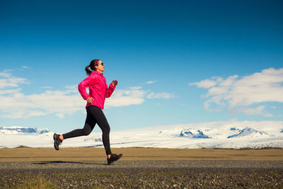 Beautiful woman practicing some winter running